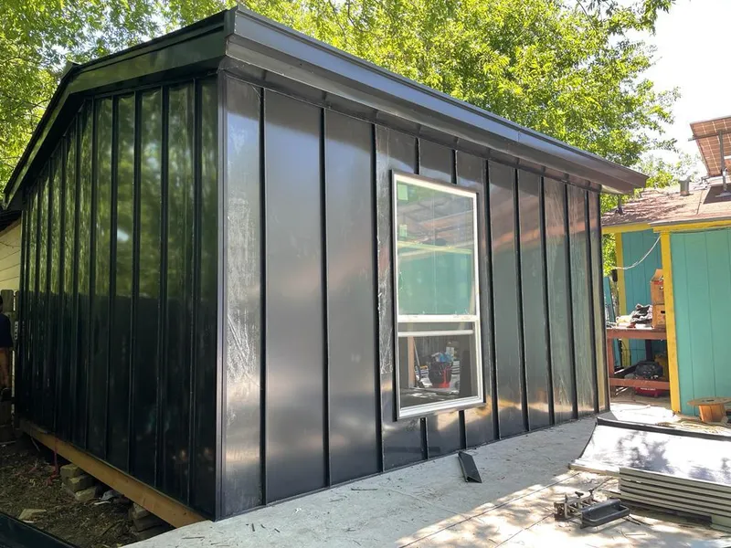 Black standing seam metal wall panels for Metal Roof Installation in Peppermill Village