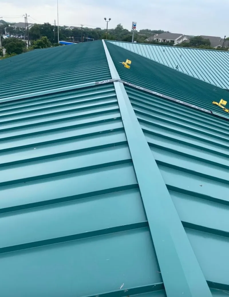 Green commercial metal roof ridge and valley for Metal Roof Repair in Peppermill Village